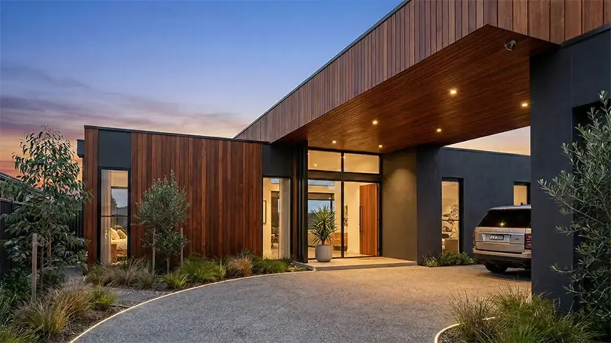 Night vision camera footage of a residential driveway